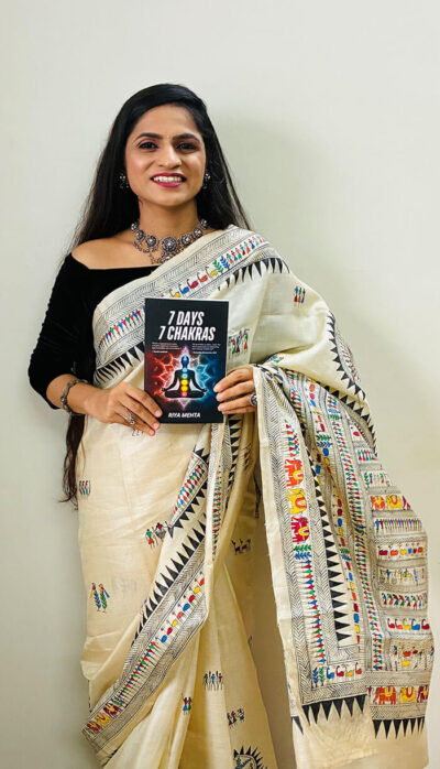 Riya Mehta with 7 Days 7 Chakras Book